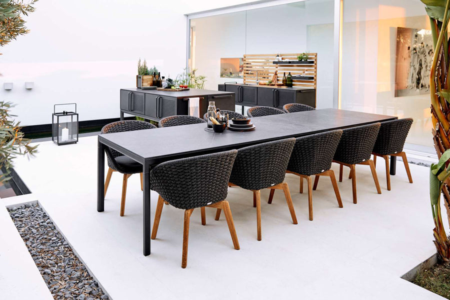Drop Kitchen Module by Cane-Line, showing drop kitchen modules with chairs & table in live shot.