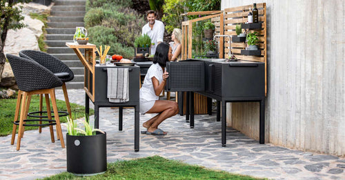 Drop Outdoor Kitchen Bar by Cane-Line, showing drop outdoor kitchen bar with module in live shot.