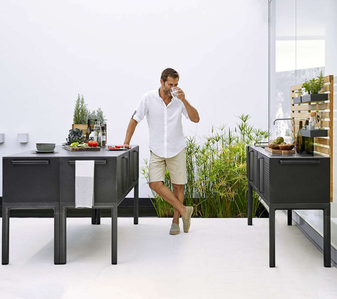 Drop Outdoor Teak Wall by Cane-Line, showing drop outdoor teak wall with drop double module in live shot.