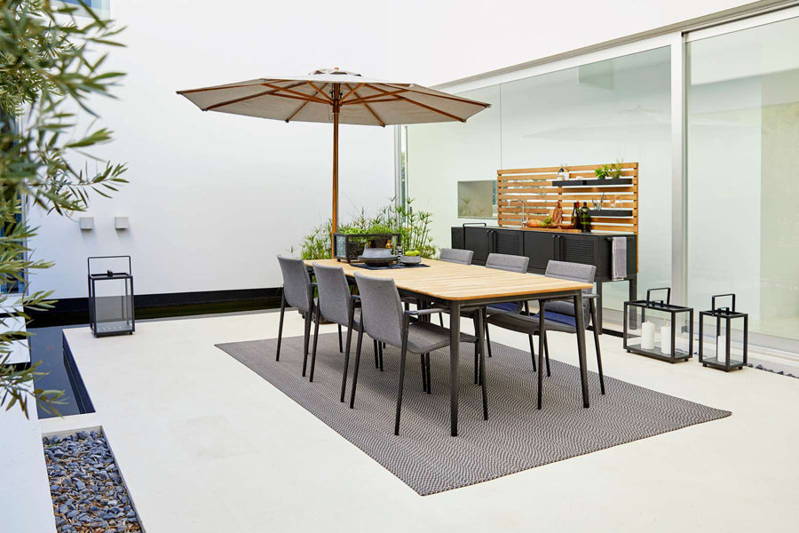 Drop Outdoor Teak Wall by Cane-Line, showing drop outdoor teak wall with drop double module in live shot.