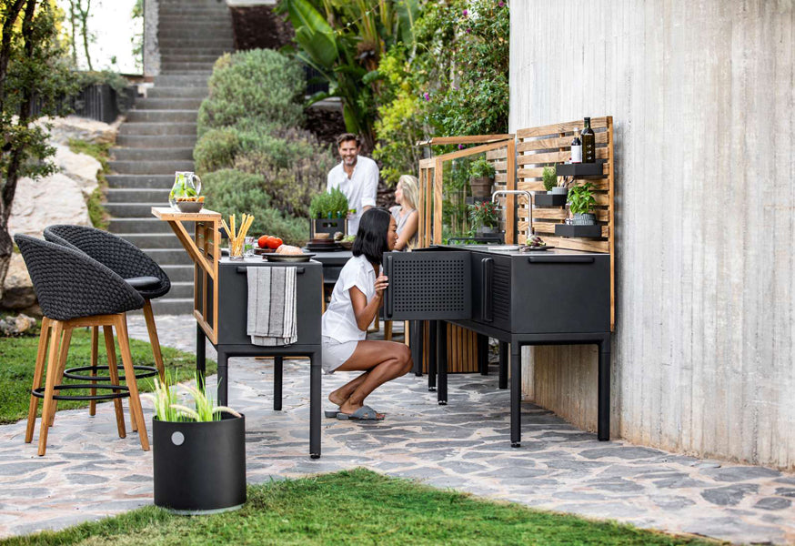 Drop Outdoor Teak Wall by Cane-Line, showing drop outdoor teak wall with drop double module in live shot.