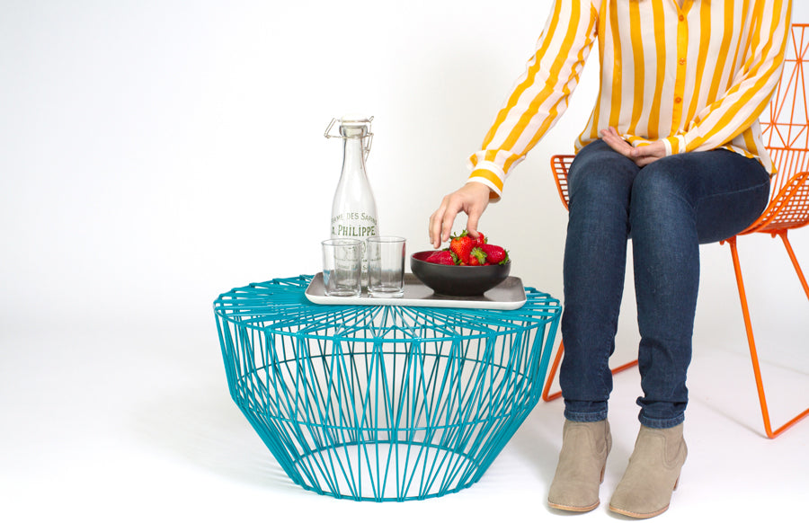 Drum Ottoman / Table by Bend, showing drum ottoman/table with chair in live shot.