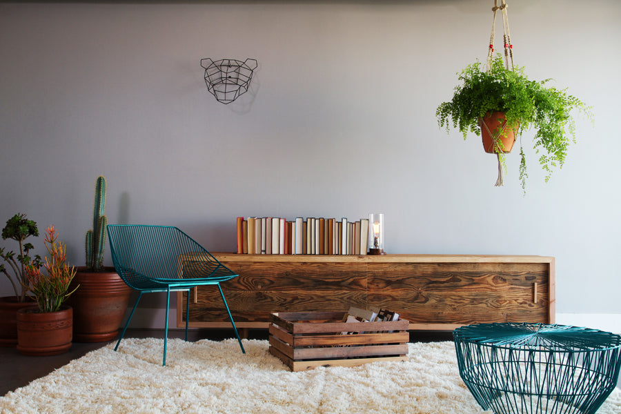 Drum Ottoman / Table by Bend, showing drum ottoman/table with chair in live shot.