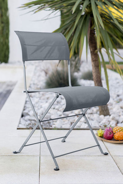 Dune Side Chair by Fermob, showing angle view of dune side chairs in storm grey (speckled matte textured).