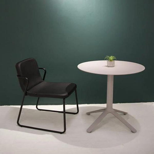 EEX Side Table by Toou, showing eex side table with chair in live shot.