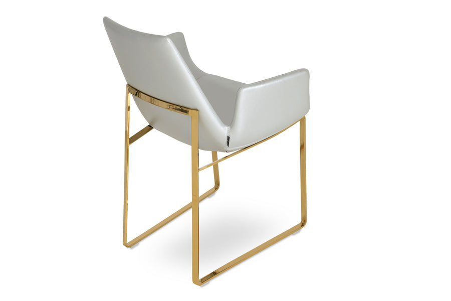 Eiffel Arm Sled Chair by SohoConcept, showing angle view in silver ppm with brass base.