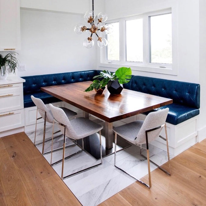 Eiffel Arm Sled Chair by SohoConcept, showing arm sled chairs with table in live shot.