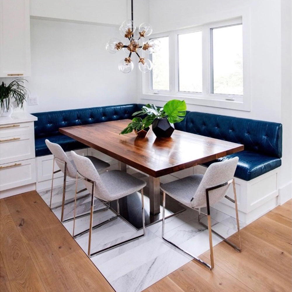 Eiffel Sled Chair by SohoConcept, showing angle view of sled chairs with table and sofa in live shot.
