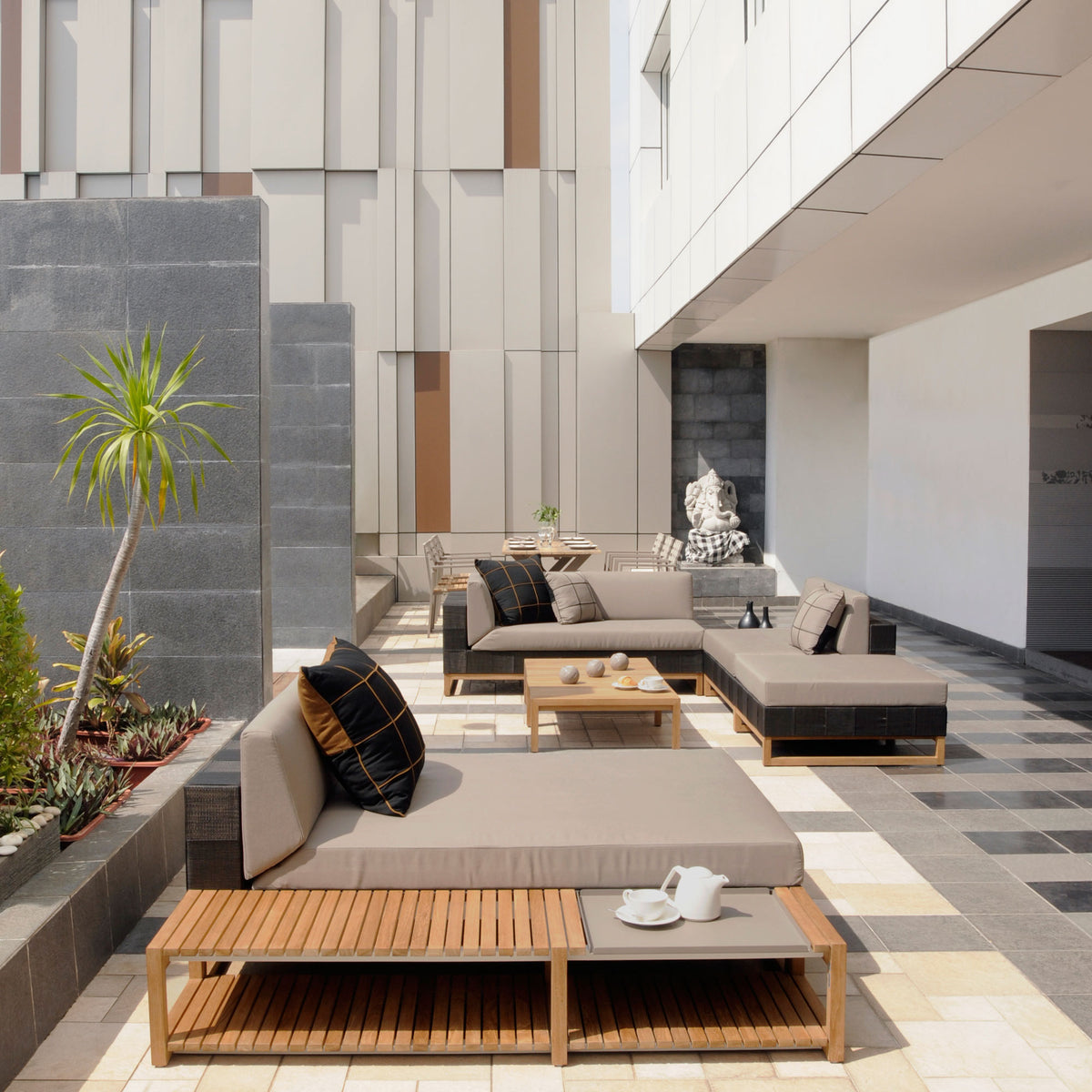 Ekka Right Hand Sectional by Mamagreen, showing ekka right hand sectional with coffee table, ekka sectional chaise and ekka sectional seat in live shot.