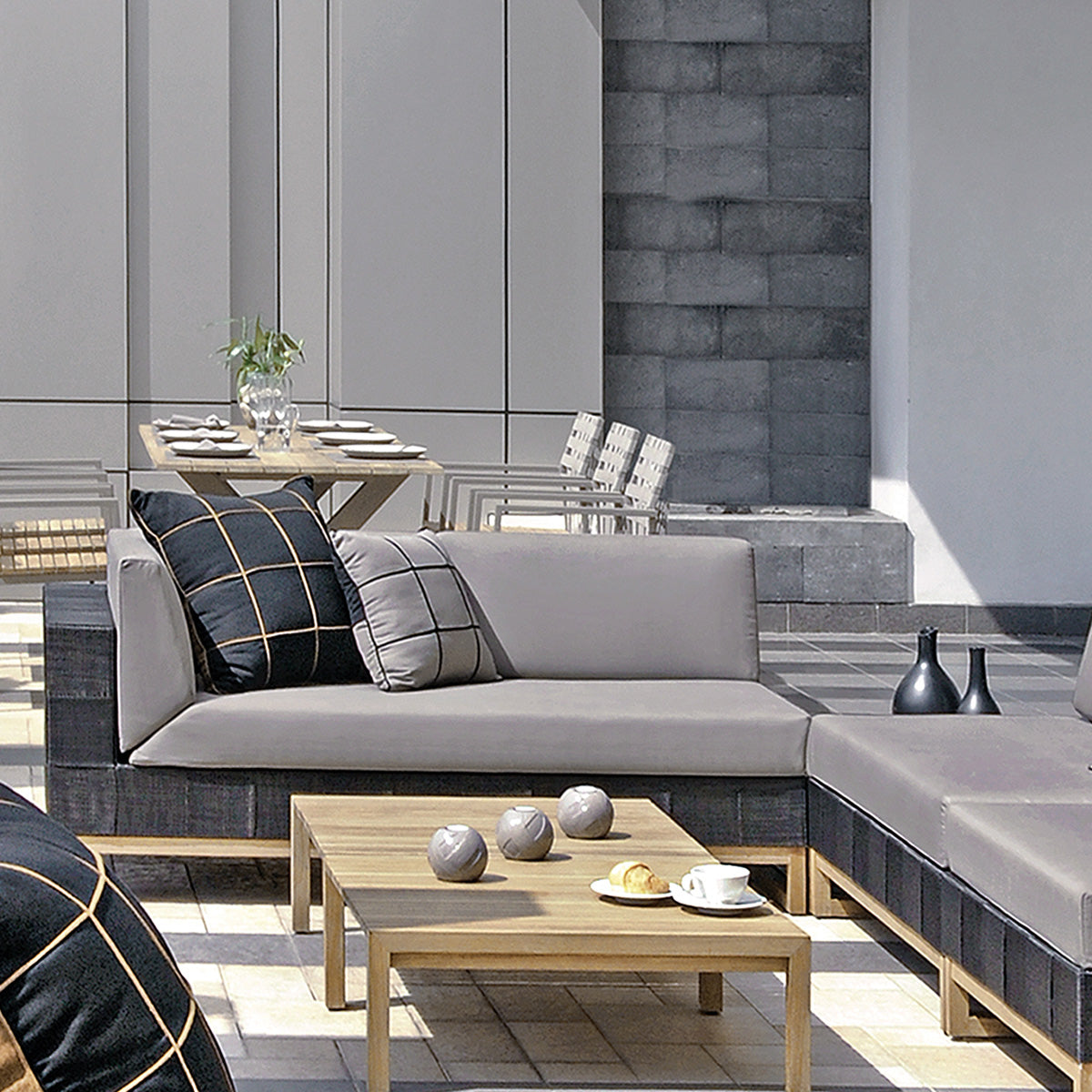 Ekka Right Hand Sectional by Mamagreen, showing closeup view of ekka right hand sectional with coffee table, ekka sectional chaise and ekka sectional seat in live shot.