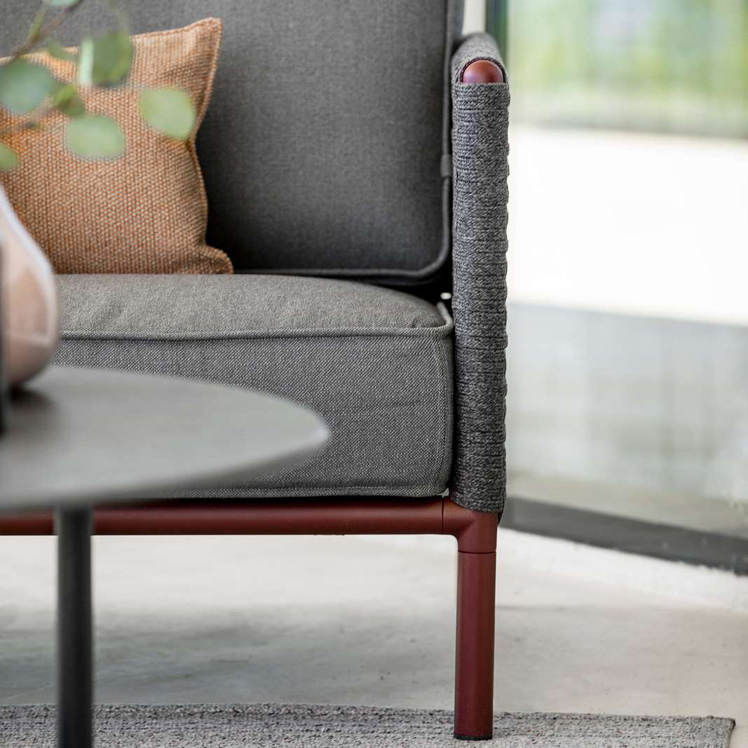 Encore Lounge Chair by Cane-Line, showing closeup view of encore lounge chair in live shot.