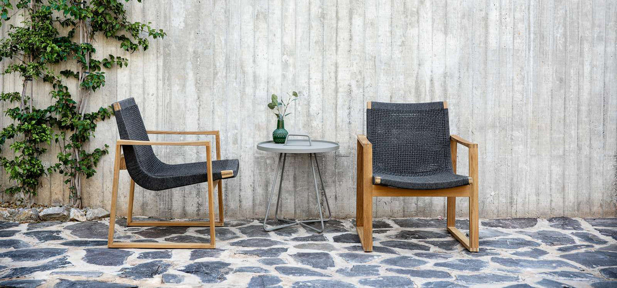 Endless Outdoor Lounge Chair by Cane-Line, showing endless outdoor lounge chairs with table in live shot.
