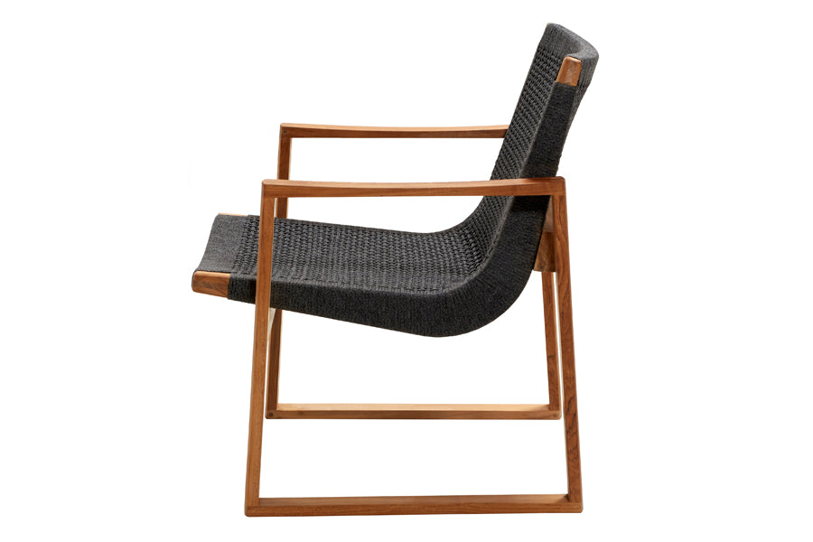 Endless Outdoor Lounge Chair by Cane-Line, showing side view of endless outdoor lounge chair in teak/dark grey soft rope.