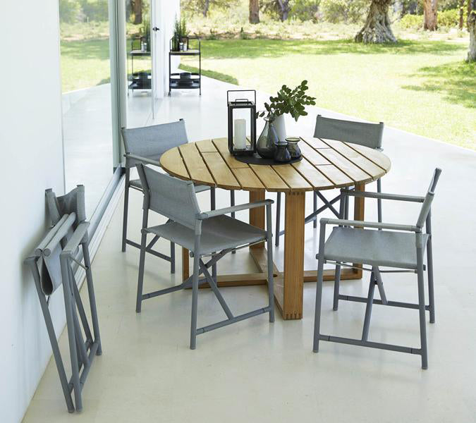 Endless Dining Table by Cane-Line, showing endless dining table with chairs in live shot.