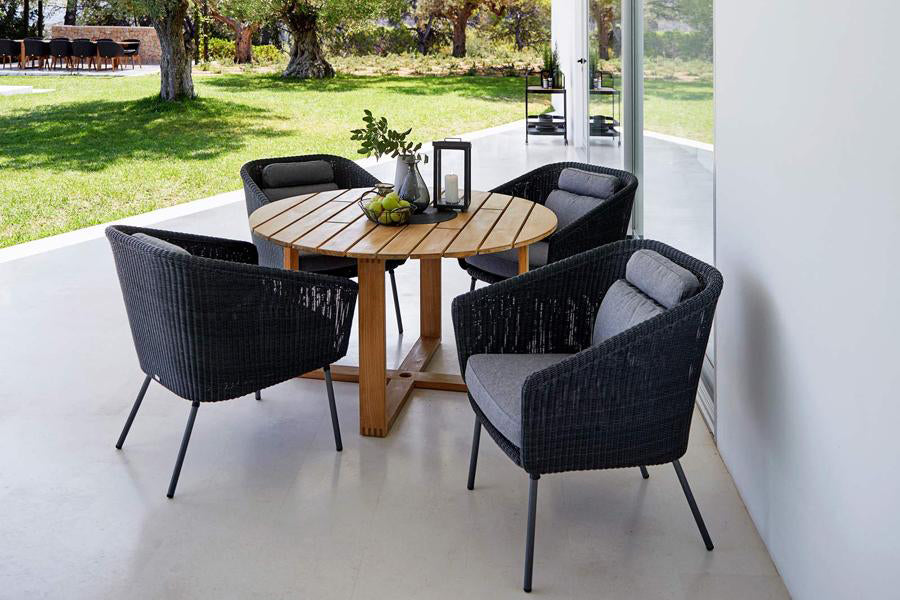 Endless Dining Table by Cane-Line, showing endless dining table with chairs in live shot.