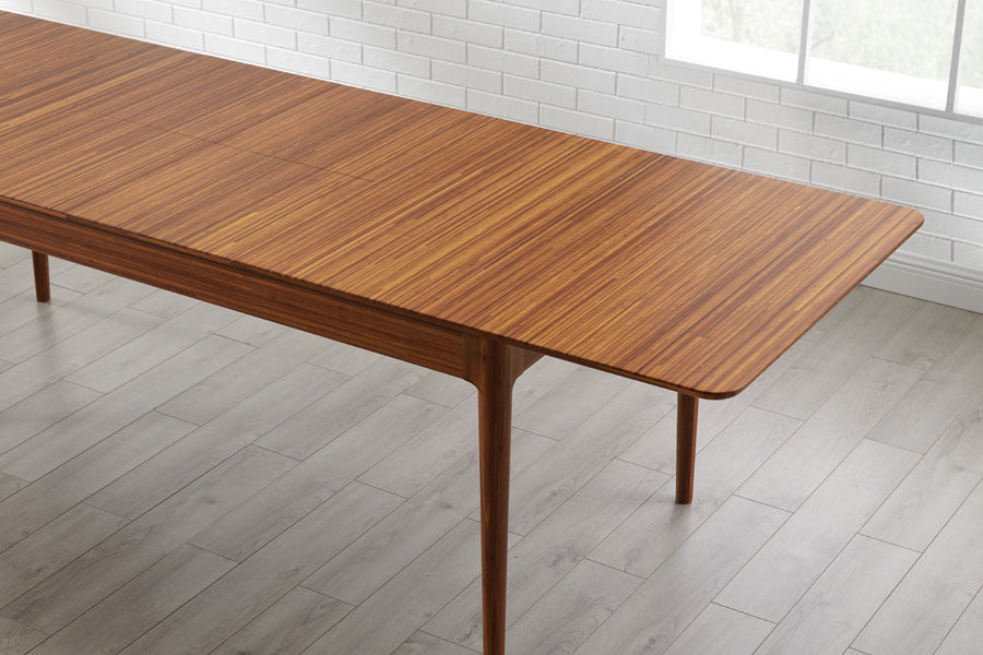 Erikka Double Leaves Extendable Dining Table by Greenington, showing closeup view of erikka double leaves extendable dining table with chairs in live shot.