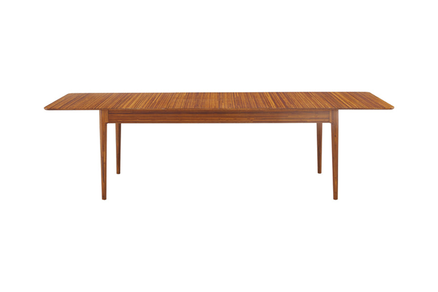 Erikka Double Leaves Extendable Dining Table by Greenington, showing front view of erikka double leaves extendable dining table in amber.