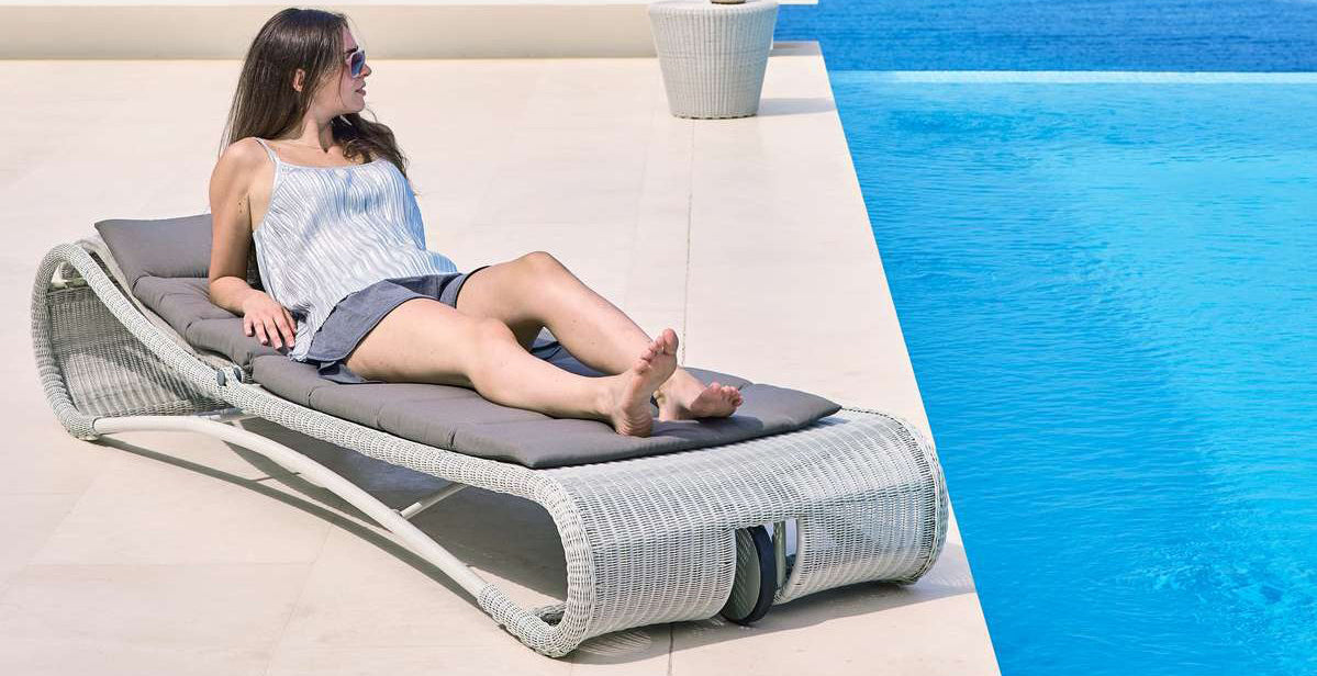 Escape Sunbed by Cane-Line, showing escape sunbed in live shot.