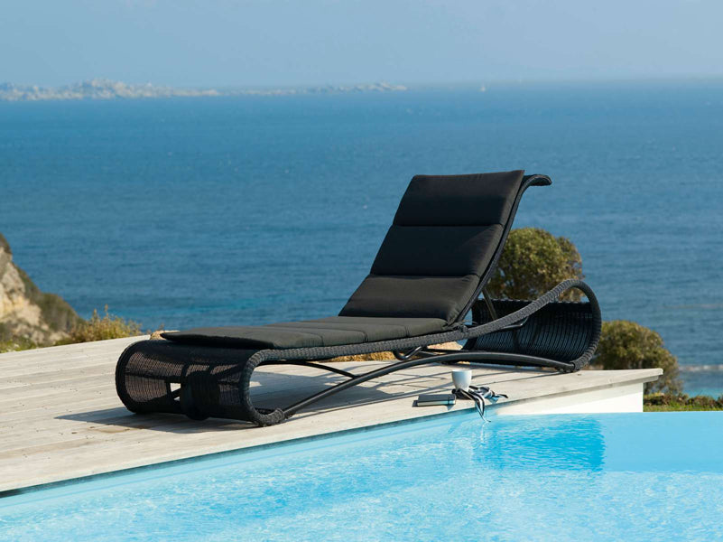 Escape Sunbed by Cane-Line, showing escape sunbed in live shot.