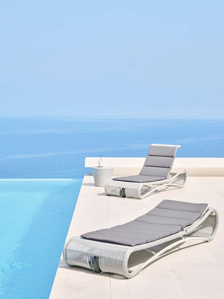 Escape Sunbed by Cane-Line, showing escape sunbeds in live shot.