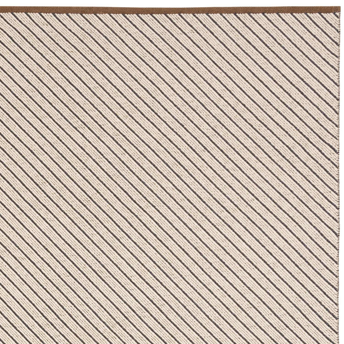 Ester Woven Plastic Rug by Brita, showing closeup view of easter woven plastic rug in beluga ester woven rug.