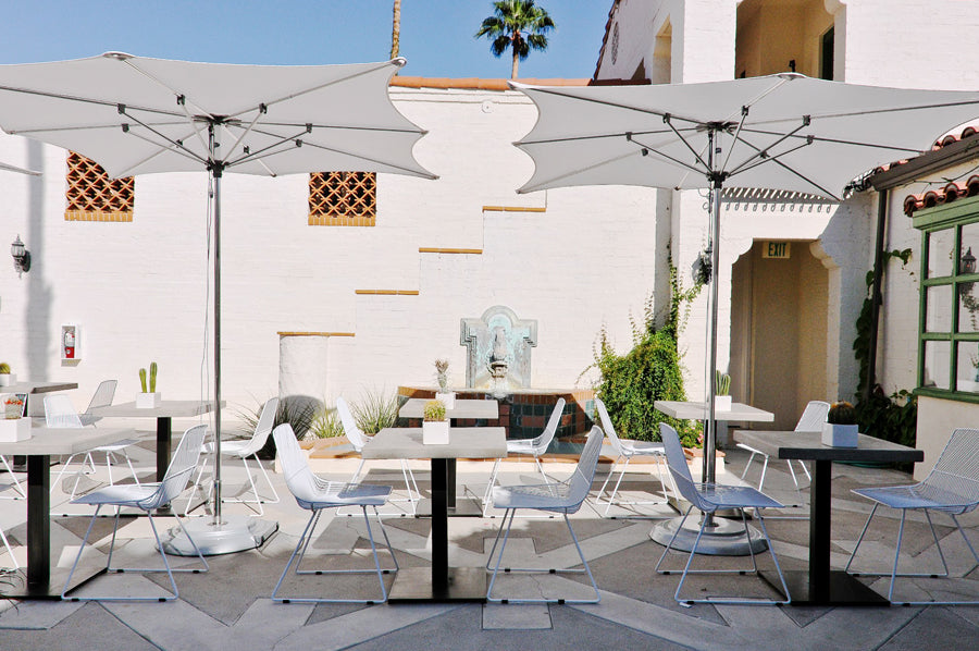 Ethel Side Chair by Bend, showing ethel side chairs with tables in live shot.