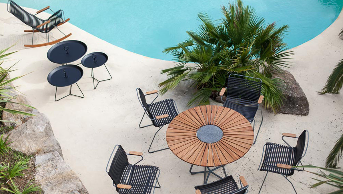Eyelet Tray Table by Houe, showing eyelet tray table with lounge chair in live shot.