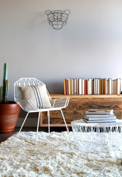 Farmhouse Lounge Chair by Bend, showing farmhouse lounge chair with table in live shot.