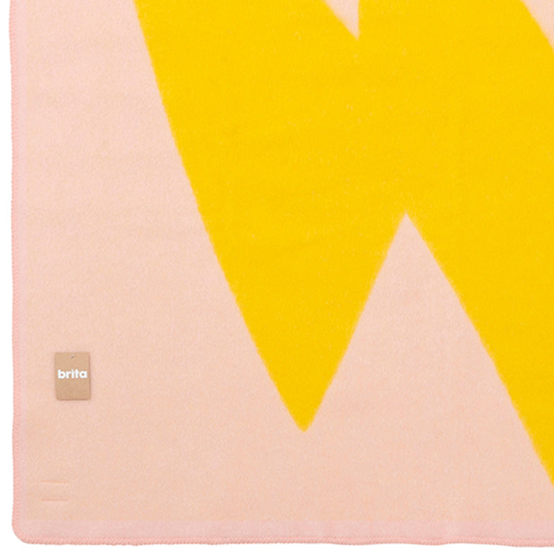 Flash Woolen Blanket by Brita, showing closeup view of flash woolen blanket in lemon flash woolen blanket.