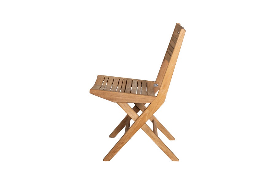 Flip Folding Teak Dining Chair by Cane-Line, showing side view of flip folding teak dining chair.