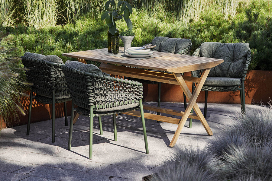 Flip Folding Teak Dining Table by Cane-Line, showing flip folding teak dining table with dining chairs in live shot.