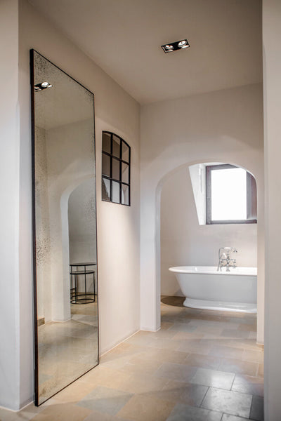 Floor Mirror by Ethnicraft, showing side view of floor mirror in live shot.