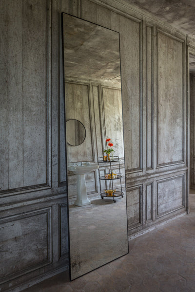 Floor Mirror by Ethnicraft, showing side view of floor mirror in live shot.