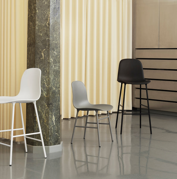Form 39" High Bar Chair by Normann Copenhagen, showing form 39" high bar chairs in live shot.