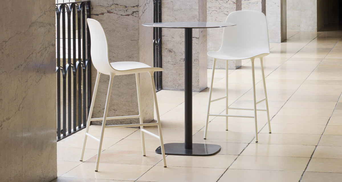 Form 39" High Bar Chair by Normann Copenhagen, showing form 39" high bar chairs in live shot.