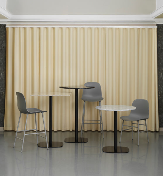 Form 39" High Bar Chair by Normann Copenhagen, showing form 39" high bar chairs in live shot.