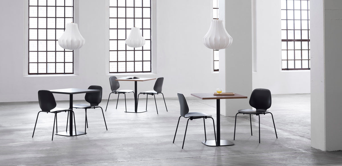 Form Cafe Table by Normann Copenhagen, showing form cafe tables in live shot.