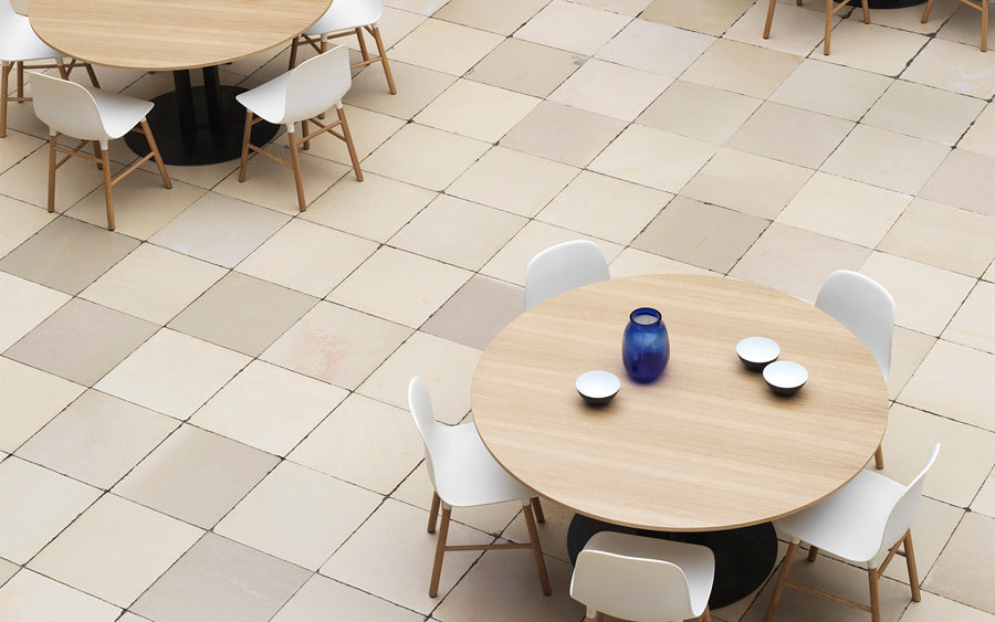 Form Chair by Normann Copenhagen, showing form chairs with tables in live shot.
