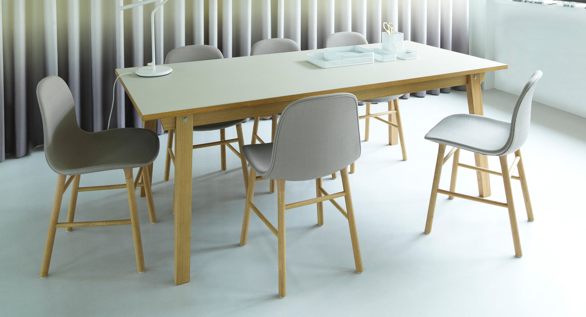 Form Chair by Normann Copenhagen, showing form chairs with table in live shot.