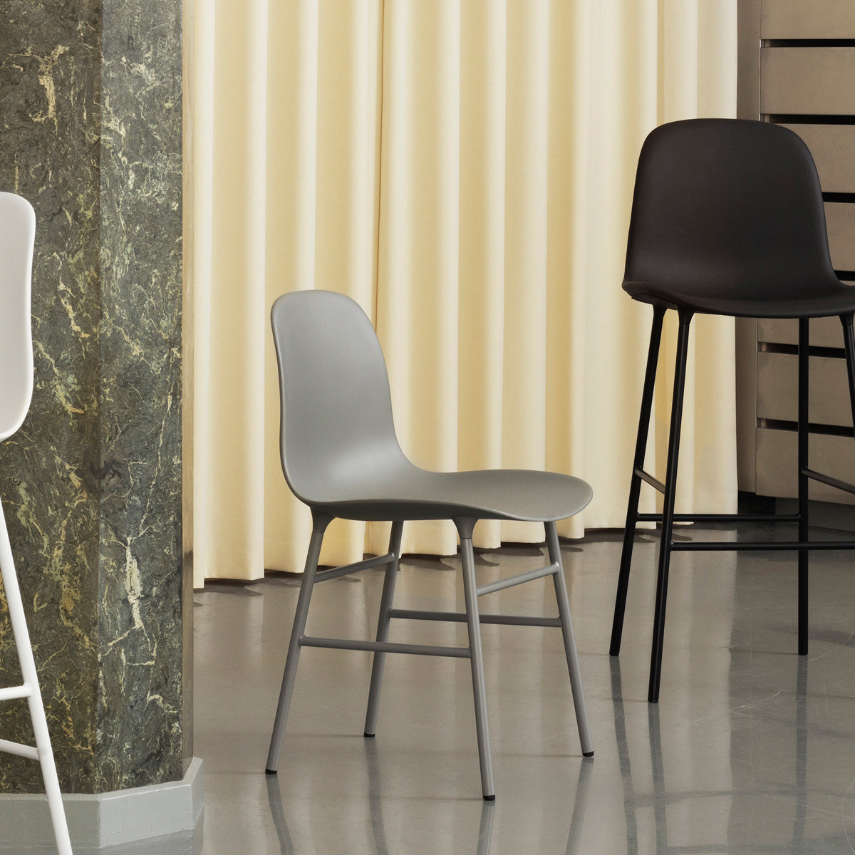 Form Chair by Normann Copenhagen, showing form chair with stools in live shot.