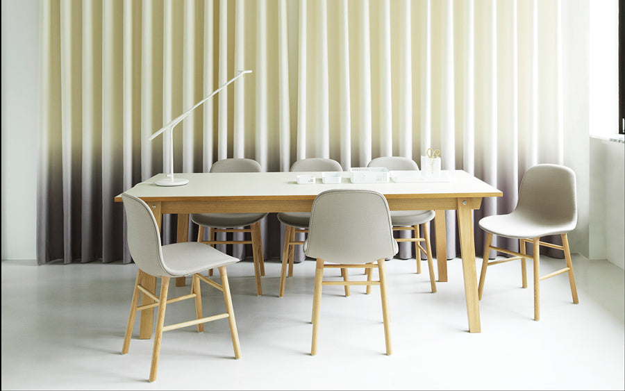 Form Chair by Normann Copenhagen, showing form chairs with table in live shot.