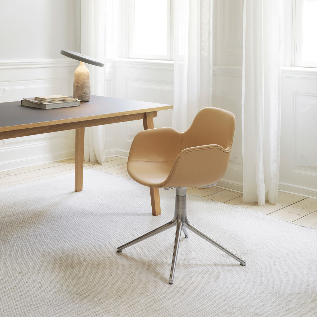 Form Swivel Chair by Normann Copenhagen, showing form swivel chair in live shot.