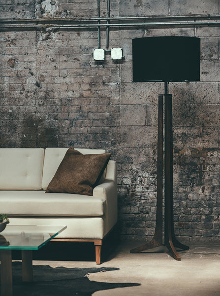 Forma Floor Lamp by Cerno, showing forma floor lamp with sofa in live shot.