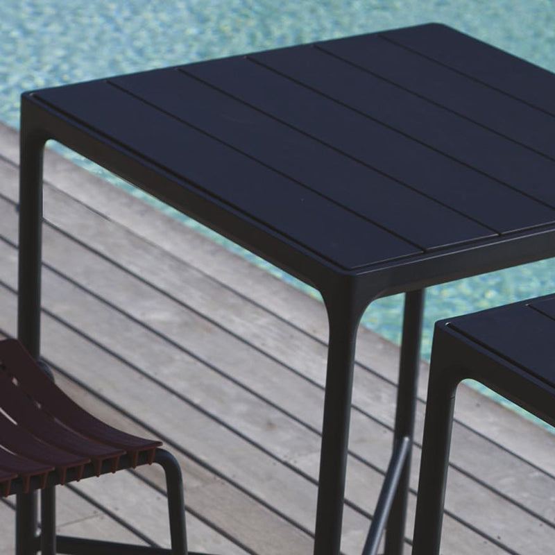 Four Outdoor Bar Table by Houe, showing four outdoor bar table with bar stool in live shot.