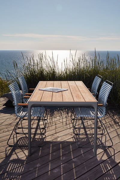 Four Outdoor Dining Table by Houe, showing four outdoor dining table with chairs in live shot.