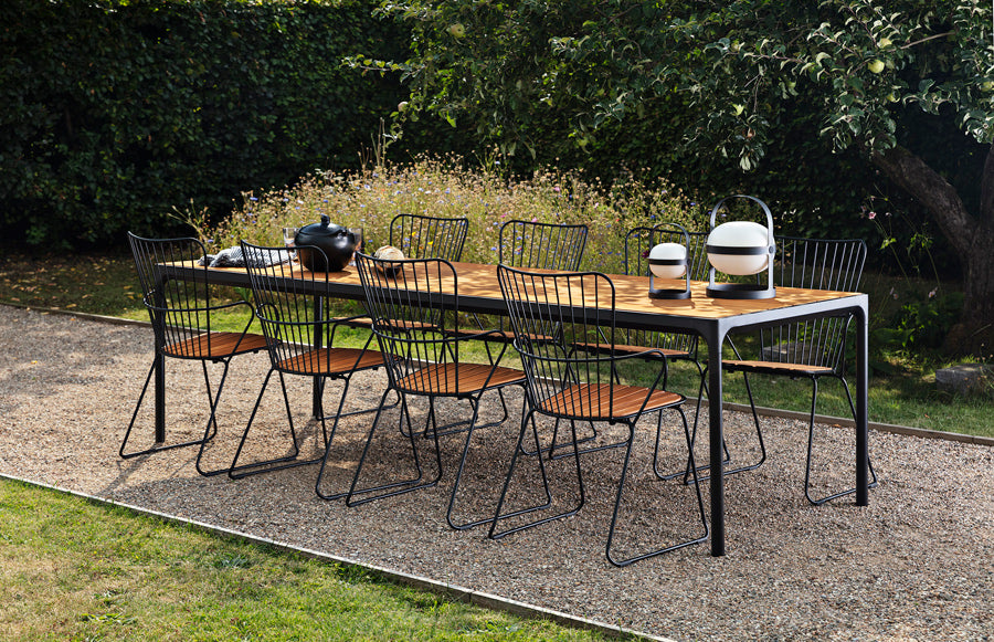 Four Outdoor Dining Table by Houe, showing four outdoor dining table with chairs in live shot.