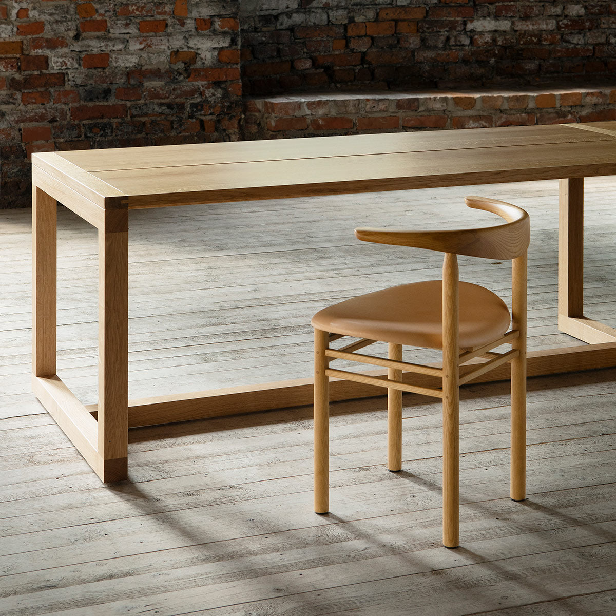 Frame Dining Table by Nikari, showing closeup view of frame dining table in live shot.