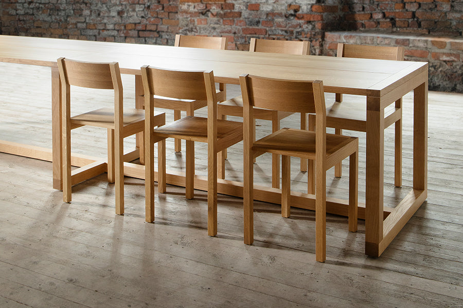 Frame Dining Table by Nikari, showing closeup view of frame dining table in live shot.
