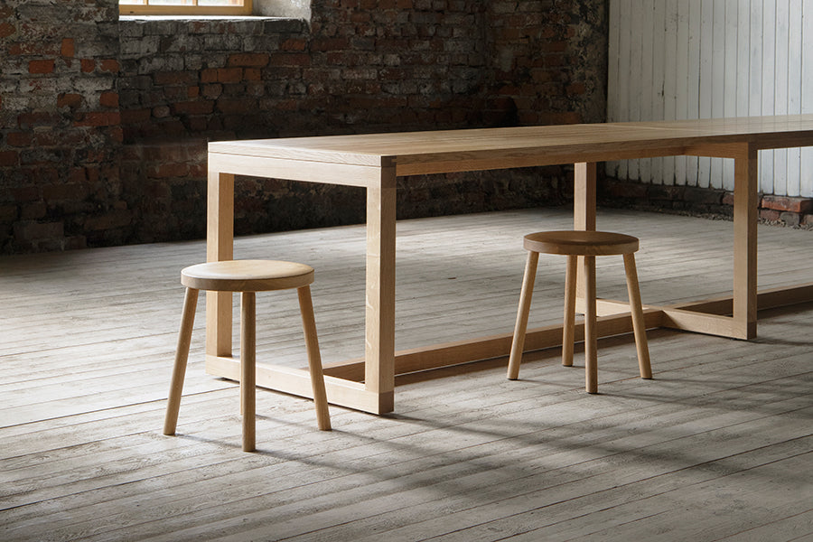 Frame Dining Table by Nikari, showing closeup view of frame dining table in live shot.