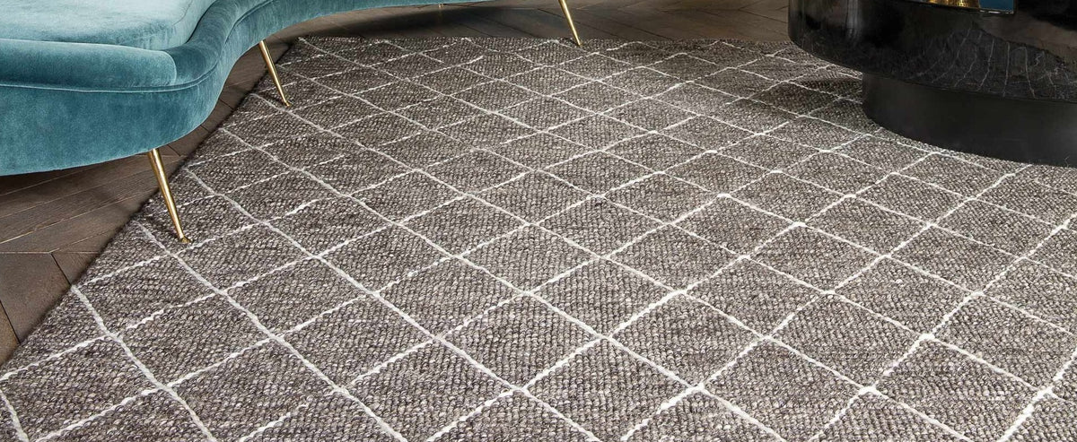 Framework 229.001.900 Hand Woven Rug by Ligne Pure, showing closeup view of framework hand wovn rug in live shot.